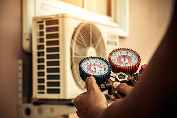 Professional Hvac technician working in Greenville, RI